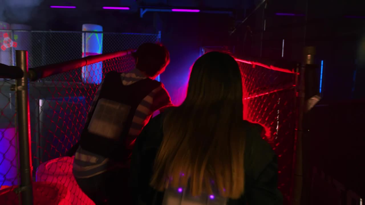 Stock Video Couple Of Friends Having Fun Playing Laser Tag Live Wallpaper For PC - Free Download