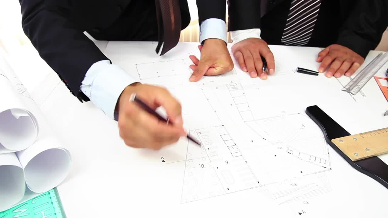 Free Stock Video Two People Discussing An Architectural Blueprint Live Wallpaper - Free Download