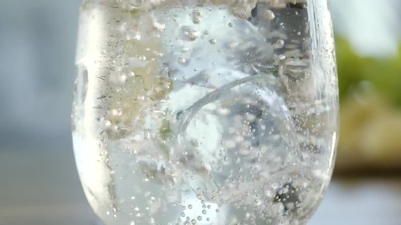Stock Video Ice Cube Drops Into Mineral Water Animated Wallpaper - Free Download