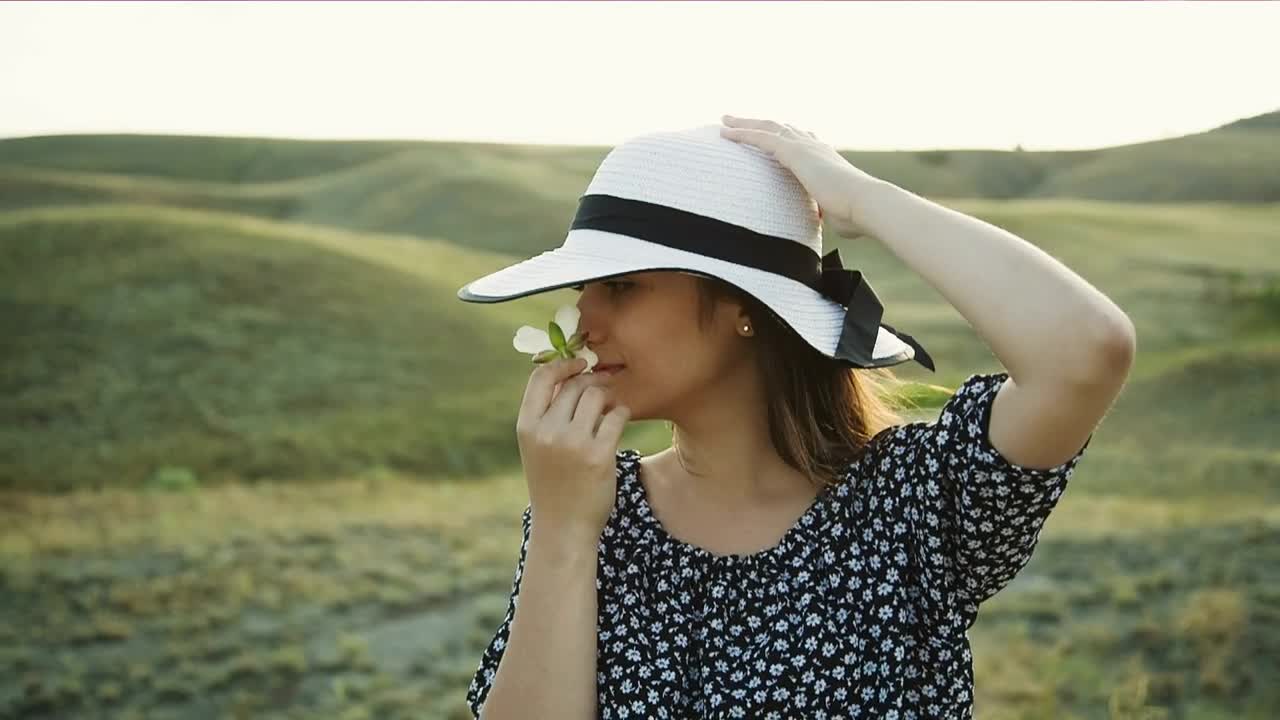 Free Stock Video Woman In The Countryside Smelling A White Flower Live Wallpaper - Free Download
