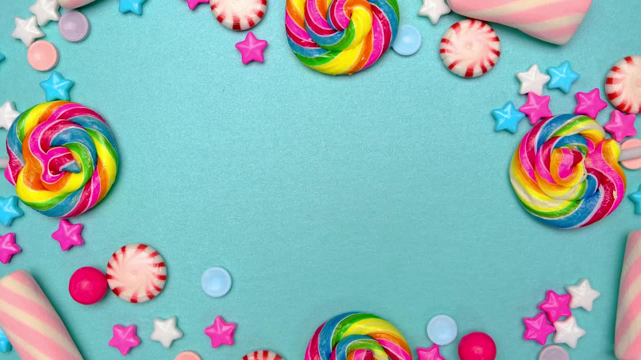 Stock Video Frame Of Candies Lollipops And Chocolates On A Blue Background Live Wallpaper For PC - Free Download
