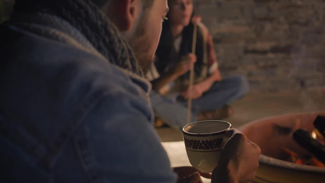 Stock Video Man Drinking Homemade Coffee On A Campfire Night Animated Wallpaper - Free Download