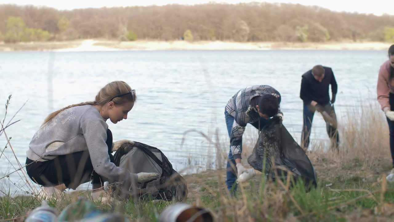 Free Stock Video Volunteers Cleaning Up Trash Next To A River Live Wallpaper - Free Download