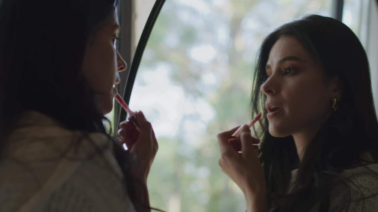 Free Stock Video Woman Applying Makeup In Front Of A Mirror Live Wallpaper - Free Download