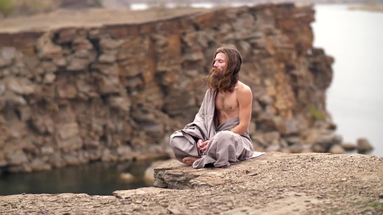 Stock Video Man Meditating On The Hill By The Se Animated Wallpaper - Free Download