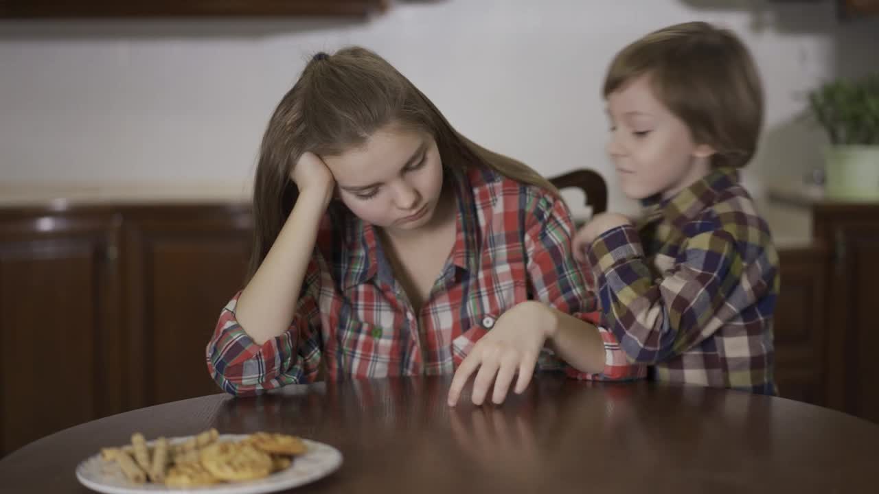 Stock Video Little Brother Whispers A Secret To His Sister Animated Wallpaper - Free Download