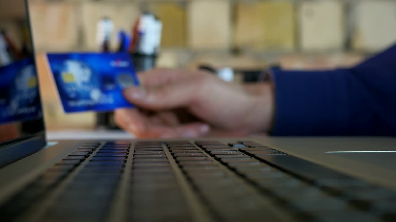 Stock Video Holding Credit Card And Typing On A Keyboard Animated Wallpaper - Free Download
