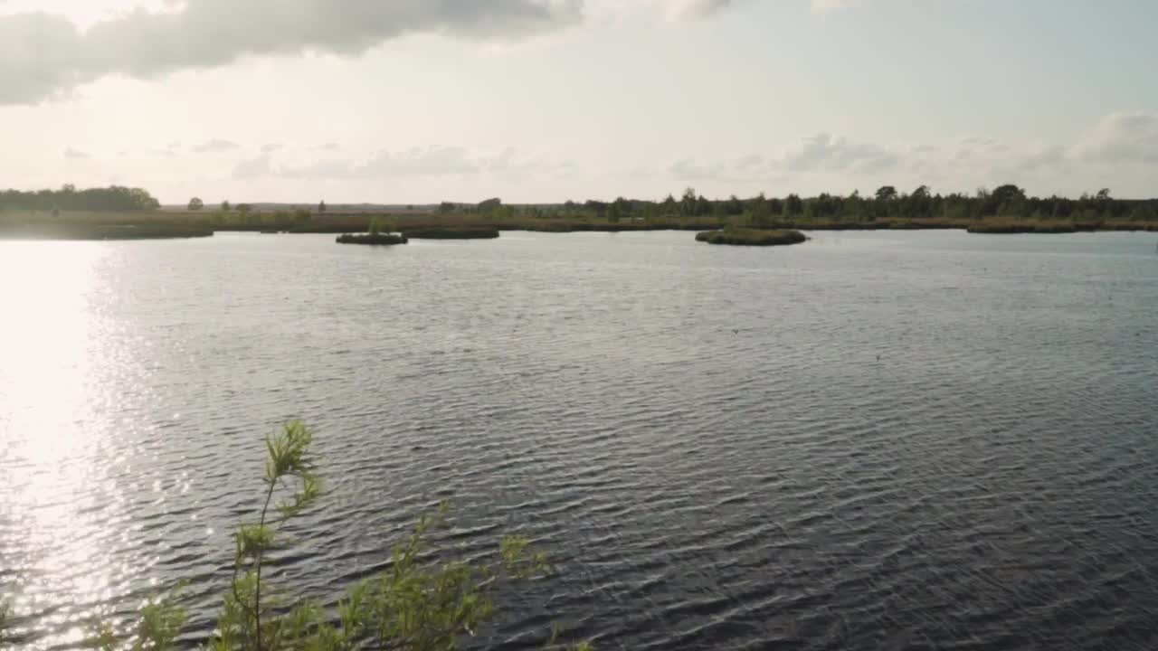 Stock Video Big Lake Reflecting Sunlight Live Wallpaper For PC - Free Download
