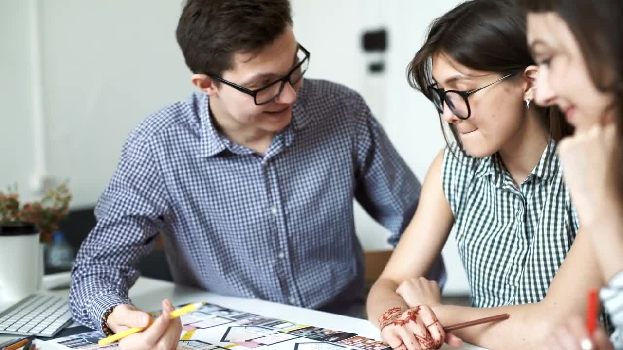 Free Video Stock three architects working on a blueprint Live Wallpaper - Free Download