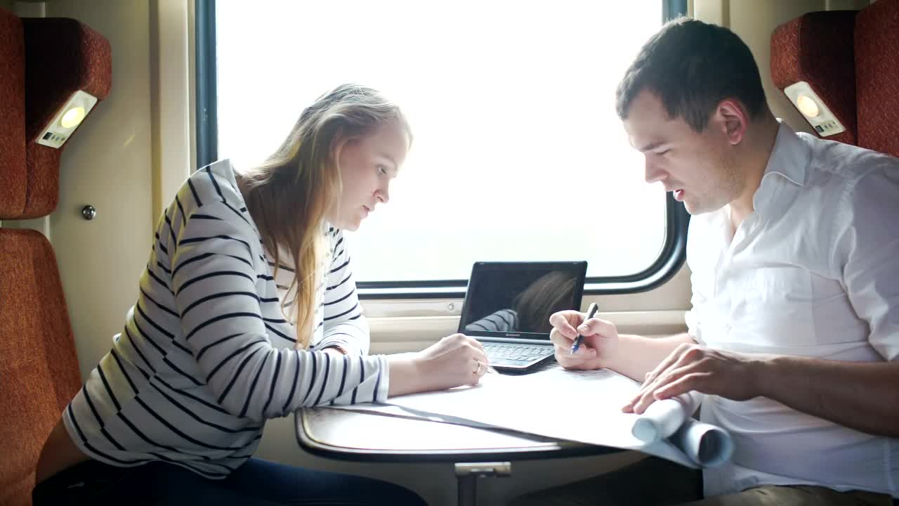 Stock Video Couple Working During A Train Journey Live Wallpaper For PC - Free Download