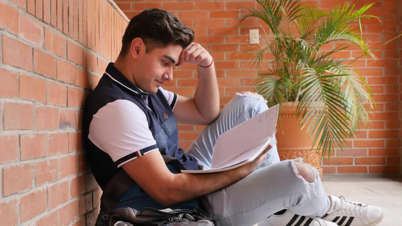 Stock Video Frustrated Student At His School Studying His Notes Live Wallpaper For PC - Free Download