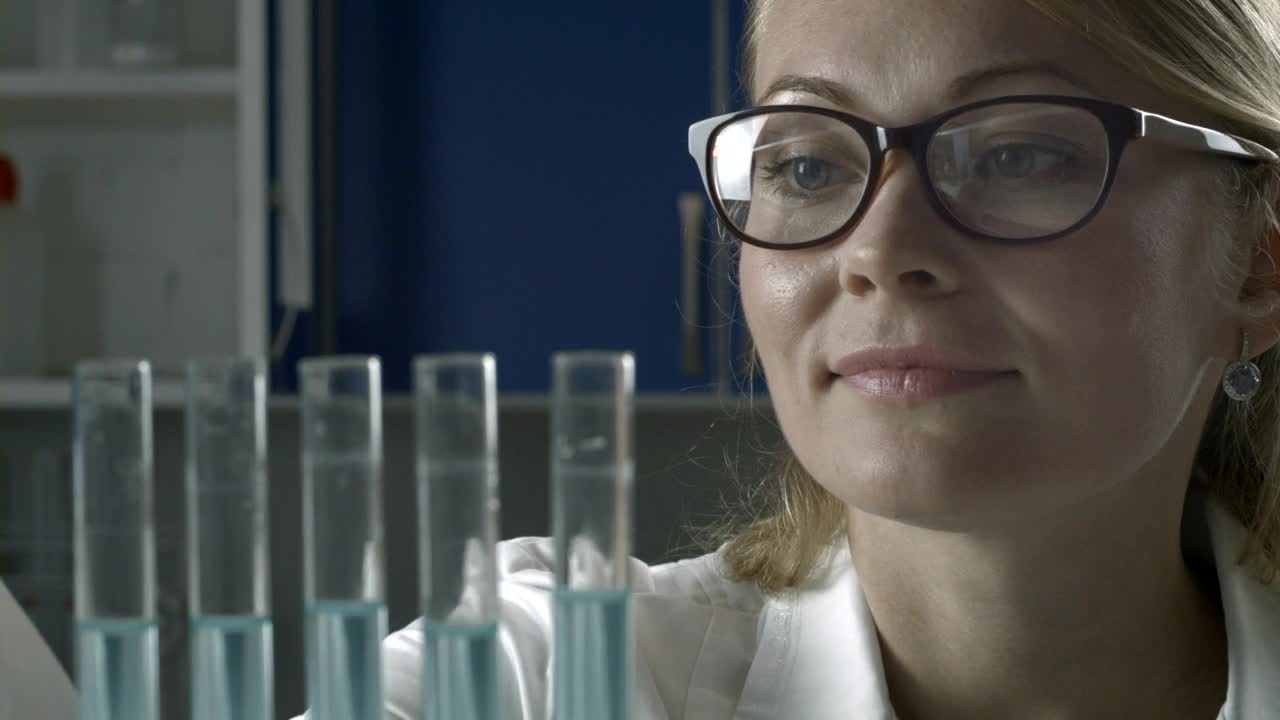 Free Stock Video Researcher Adding Blue Liquid To Test Tubes Live Wallpaper - Free Download