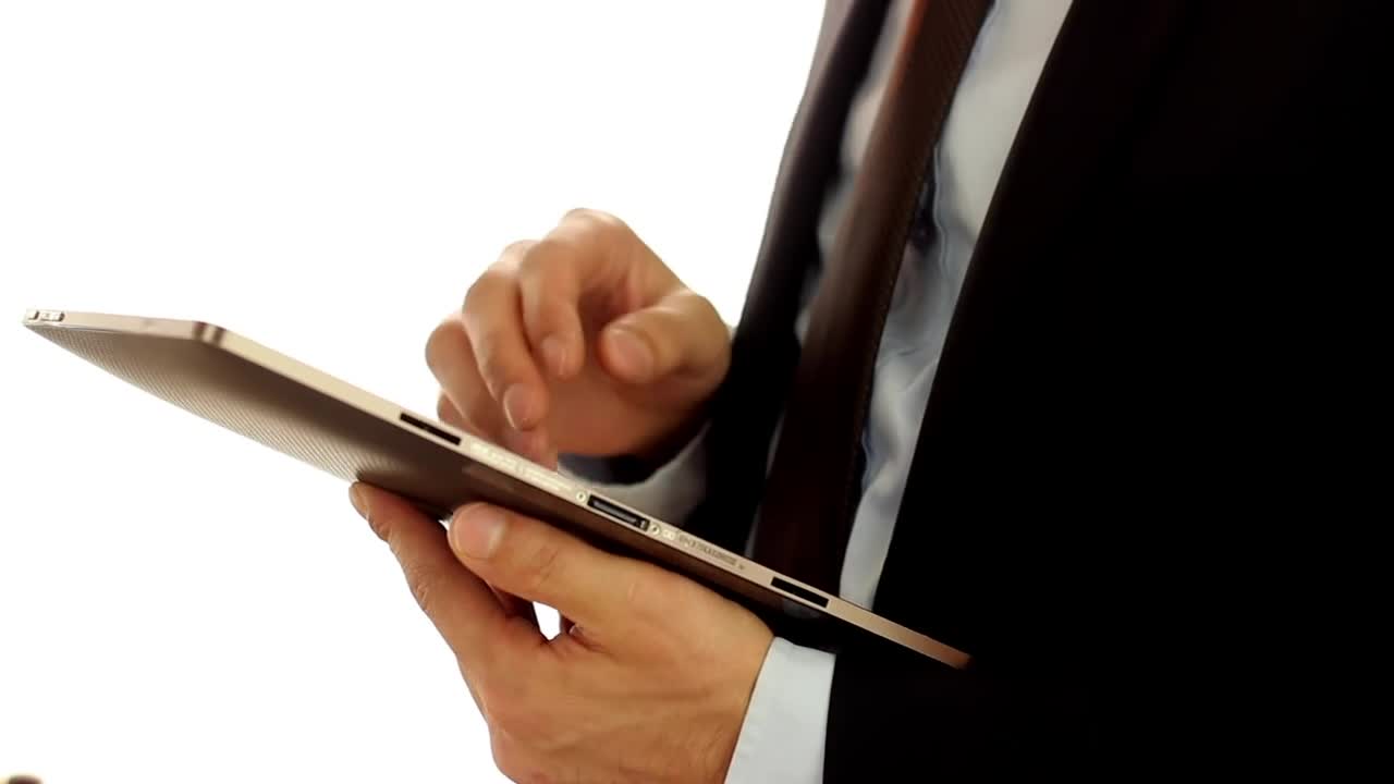 Video Stock Businessman Wearing A Suit And Using A Tablet Live Wallpaper For PC - Free Download