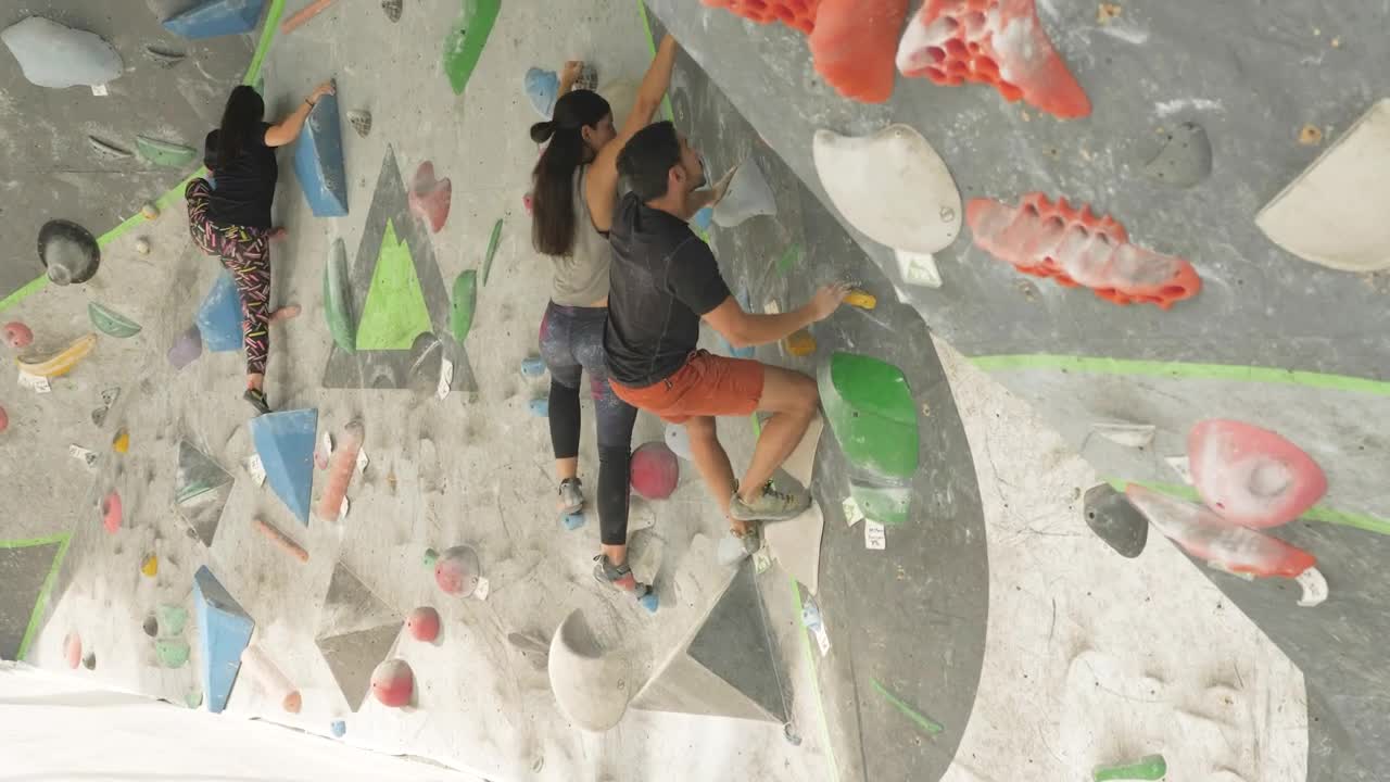 Stock Video People Climbing On A Mountaineering Wall Live Wallpaper - Free Download