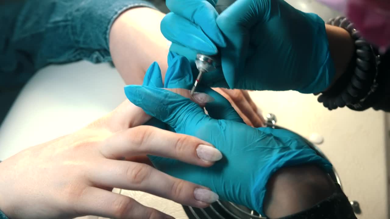 Stock Video Manicurist Working On Clients Hand Animated Wallpaper - Free Download