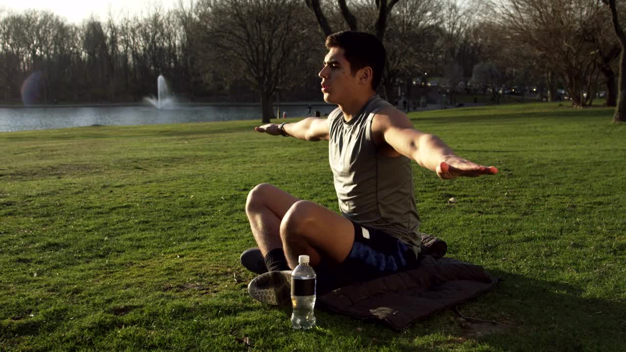 Stock Video Man Doing Yoga By A City Lake Animated Wallpaper - Free Download