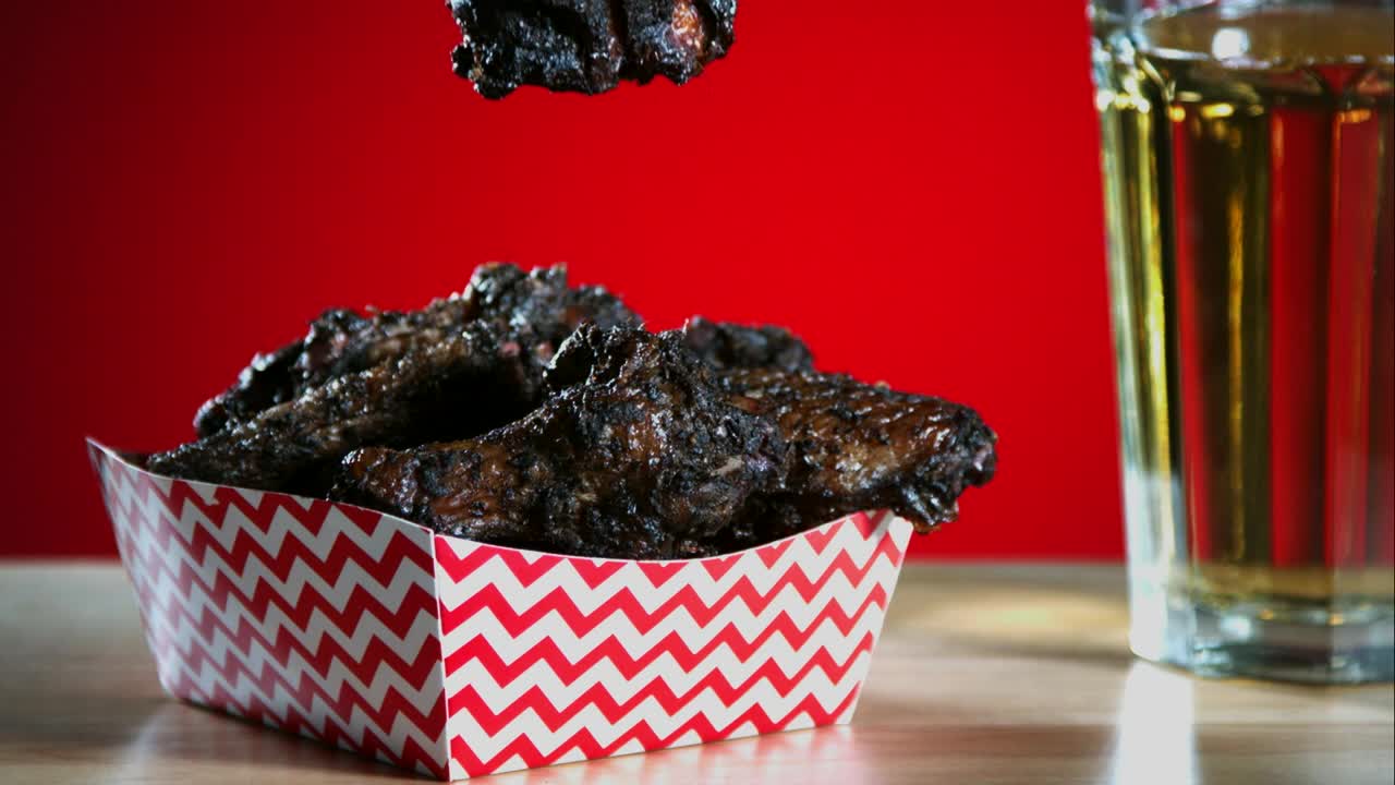 Free Video Stock Smoked Chicken Wings Falling Into The Table Live Wallpaper - Free Download