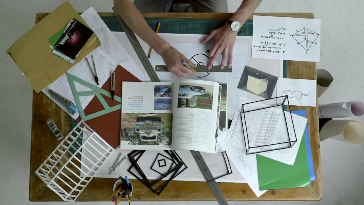 Stock Video Designer Drawing On A Messy Desk Live Wallpaper For PC - Free Download