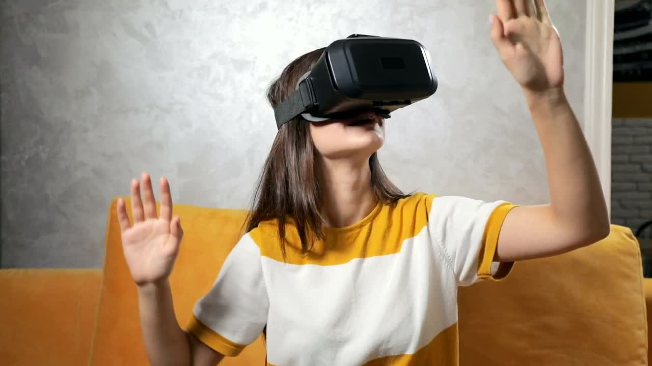 Stock Video Girl Experiences Vr Gaming Headset On Sofa Live Wallpaper For PC - Free Download