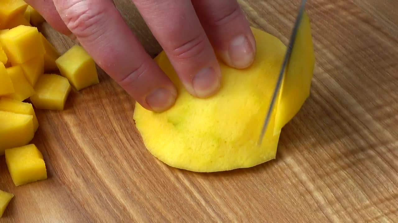 Stock Video Cutting Mango On A Board Close Up Live Wallpaper For PC - Free Download