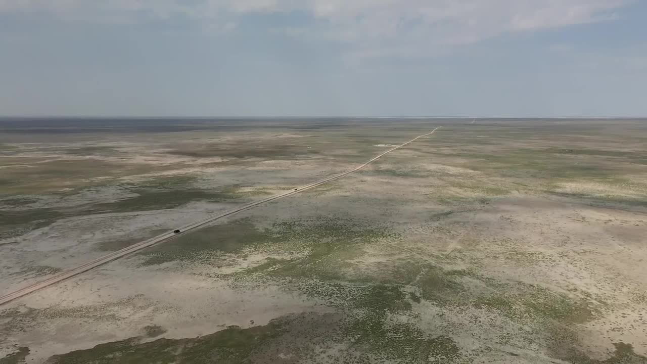 Stock Footage Van Driving Down A Long Dusty Road Live Wallpaper - Free Download