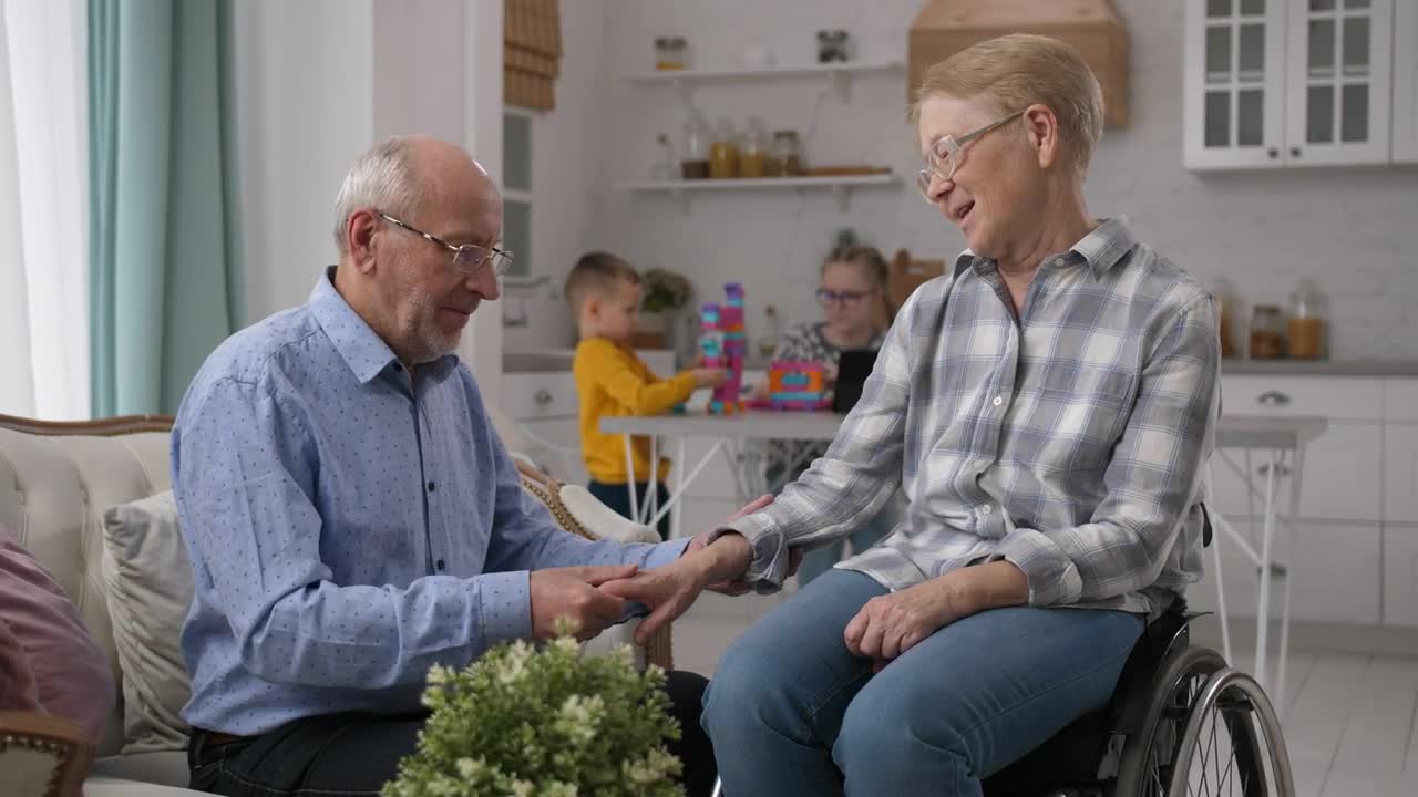 Stock Video Husband Caring For His Disabled Wife Animated Wallpaper - Free Download