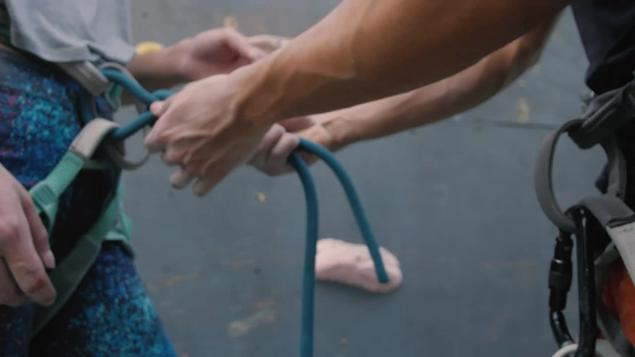 Free Stock Video Two People Adjusting Harnesses On Their Body Live Wallpaper - Free Download