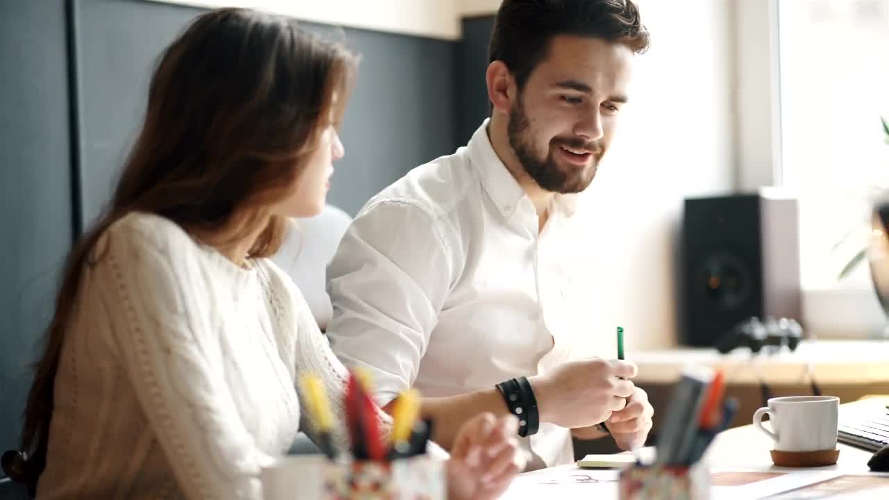Stock Video Coworkers Working Together On A Design Project Live Wallpaper For PC - Free Download