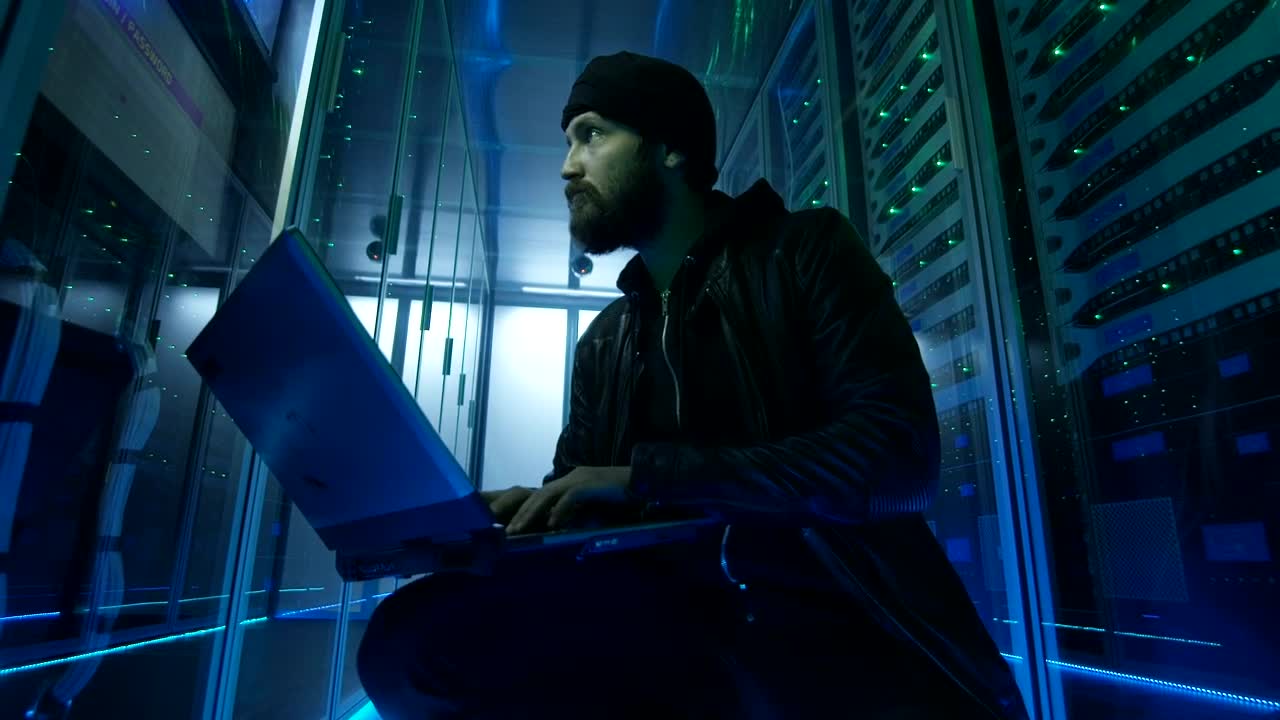Stock Video Hacker Sitting On The Ground Of Data Center Live Wallpaper For PC - Free Download